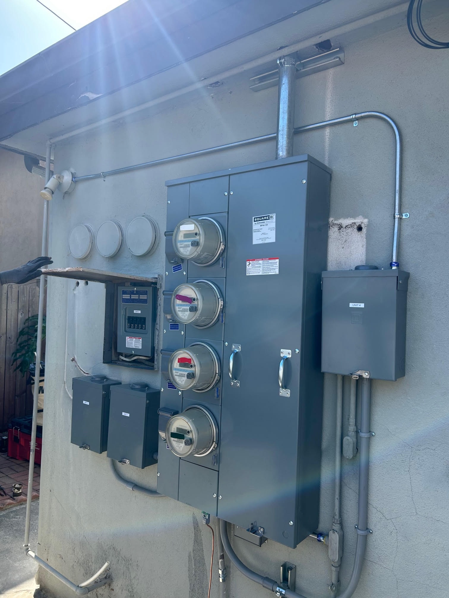 “A newly installed multi-meter electrical panel upgrade, providing safe and efficient power distribution for multiple residential units, ensuring modern capacity, compliance, and future electrical expansion.”